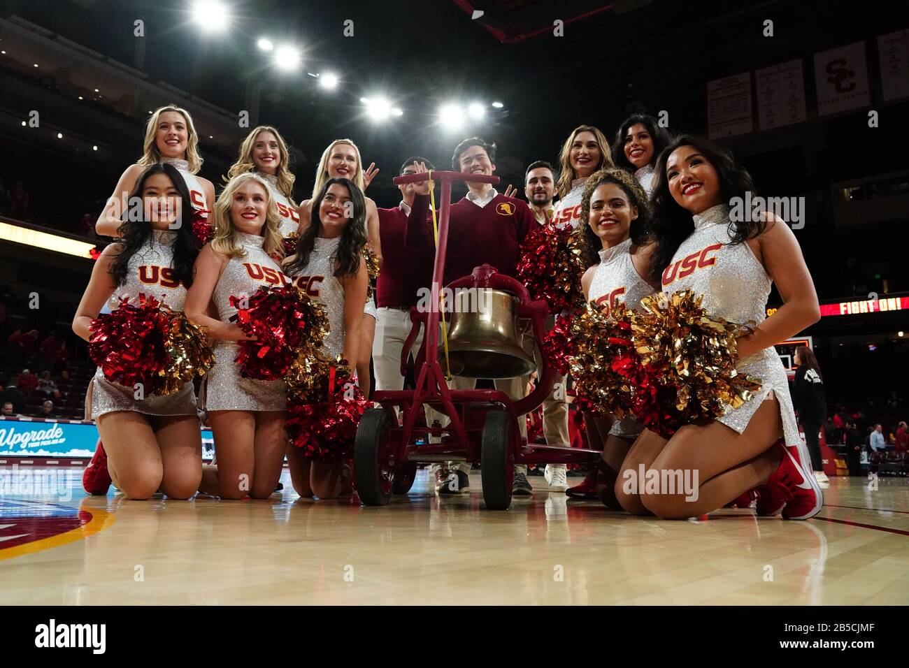 Southern California Trojans song girls cheerleaders pose with the victory bell after an NCAA college basketball game against the UCLA Bruins, Saturday, March 7, 2020, in Los Angeles. USC defeated UCLA 54-52. (Photo by IOS/ESPA-Images) Stock Photo