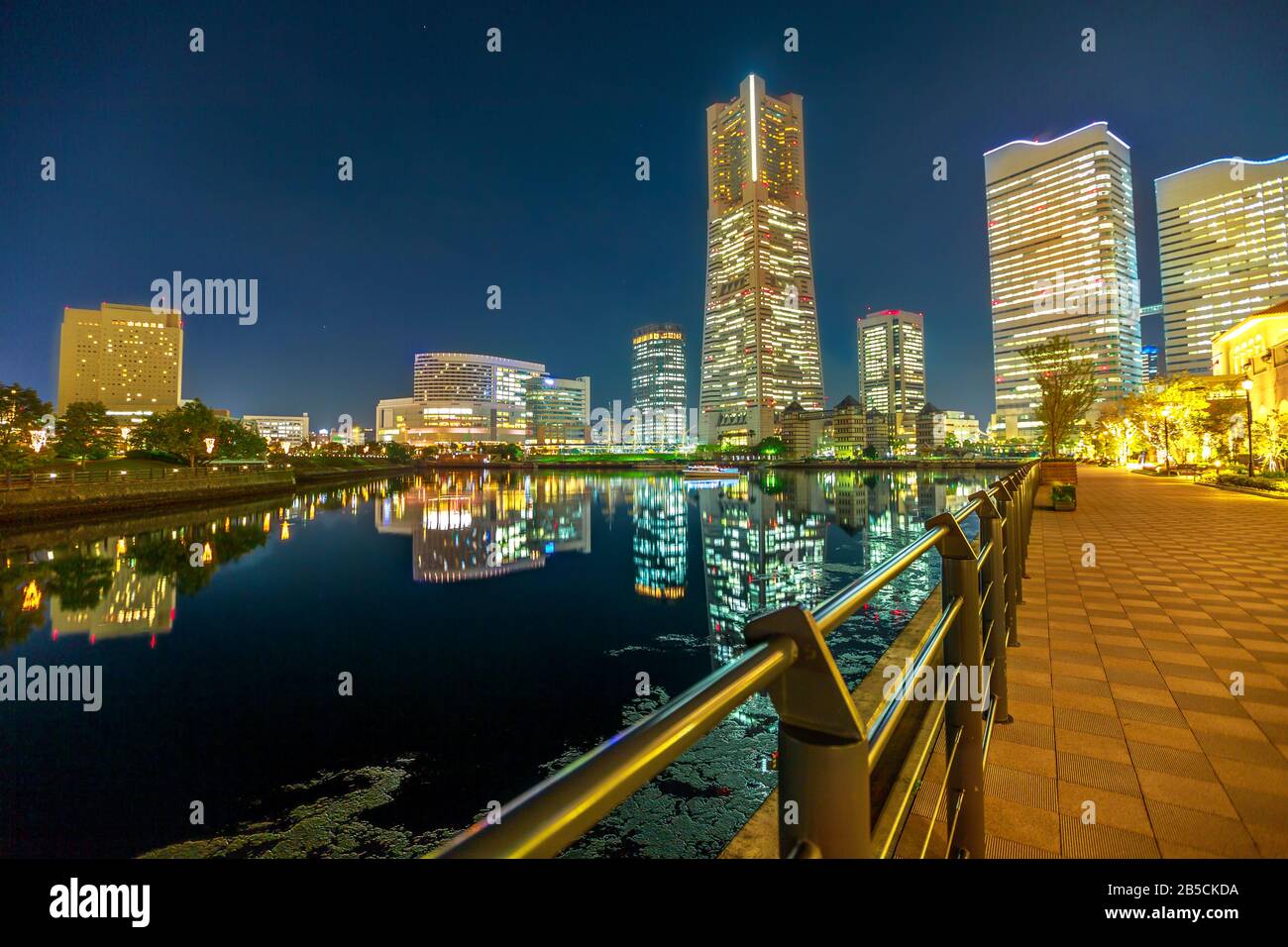 Corniche and waterfront skyline with Yokohama buildings and skyscrapers of Minato Mirai District, reflecting on the waters of bay. Cityscape of Stock Photo