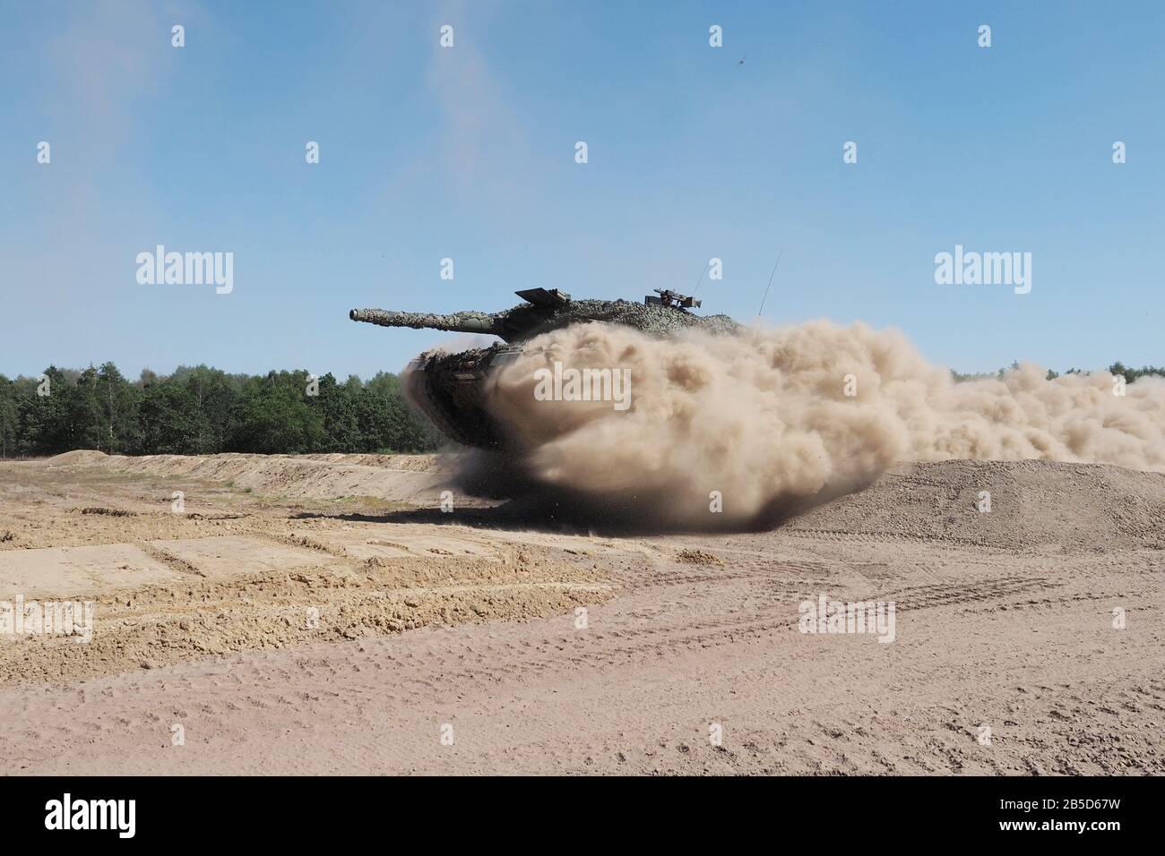 German Army Leopard 2 A5 main battle tank jumping over a ramp in  Bundeswehr combat training centre Letzlingen on Open day in June 2019. Stock Photo