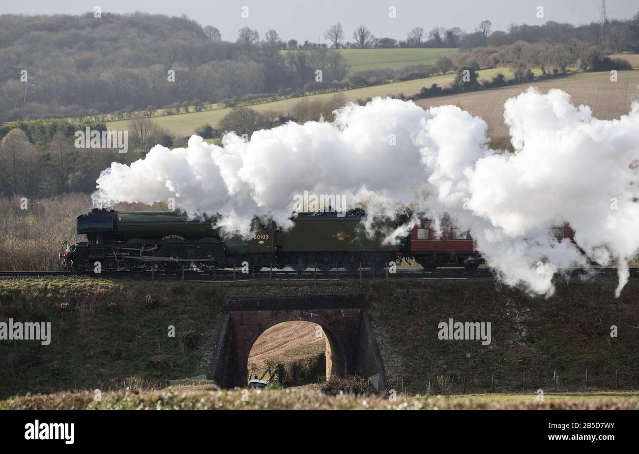 The Flying Scotsman makes it's way along the Mid Hants Railway's Watercress line near to Ropley in Hampshire. Stock Photo