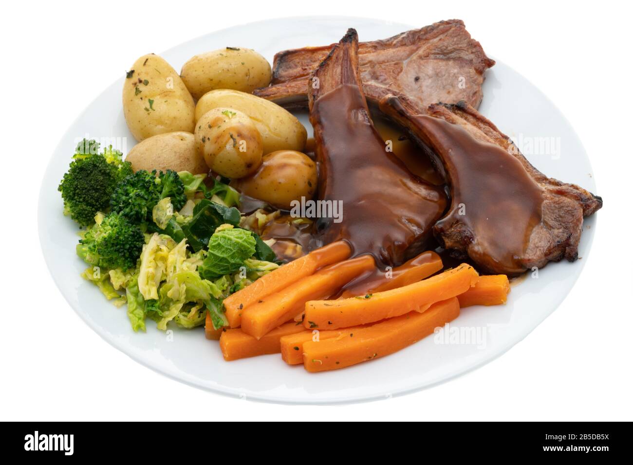 Grilled lamb chops dinner with steamed vegetables, new potatoes and