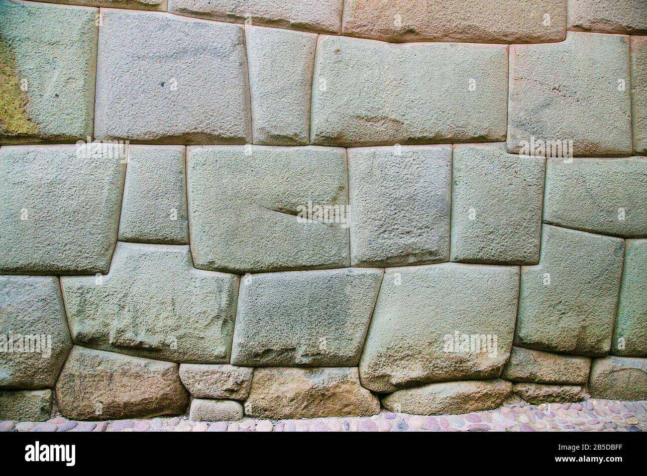 Incredible Inca Wall on Hatun Rumiyoc Street, Famous Ancient Street in Cusco, Peru, South America, Archaeological site. Stock Photo