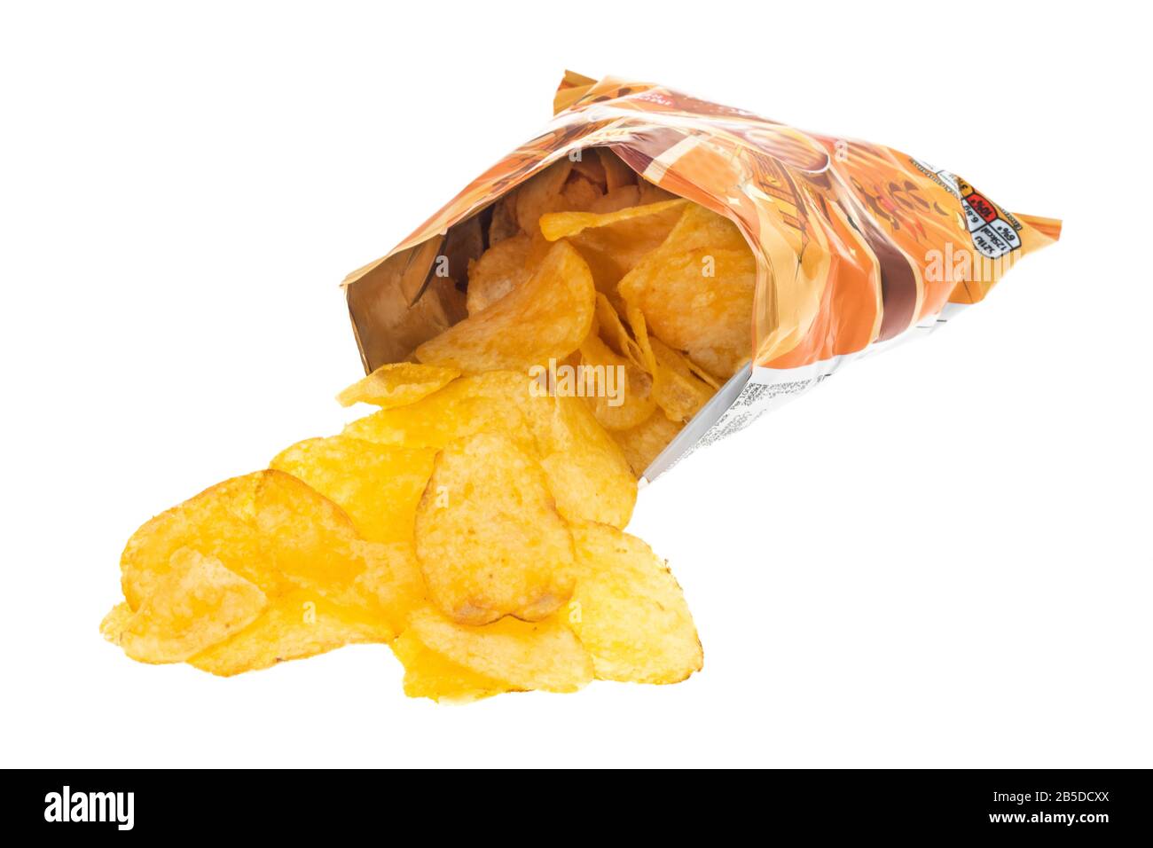 A bag of crisps with the contents spilling out white background Stock