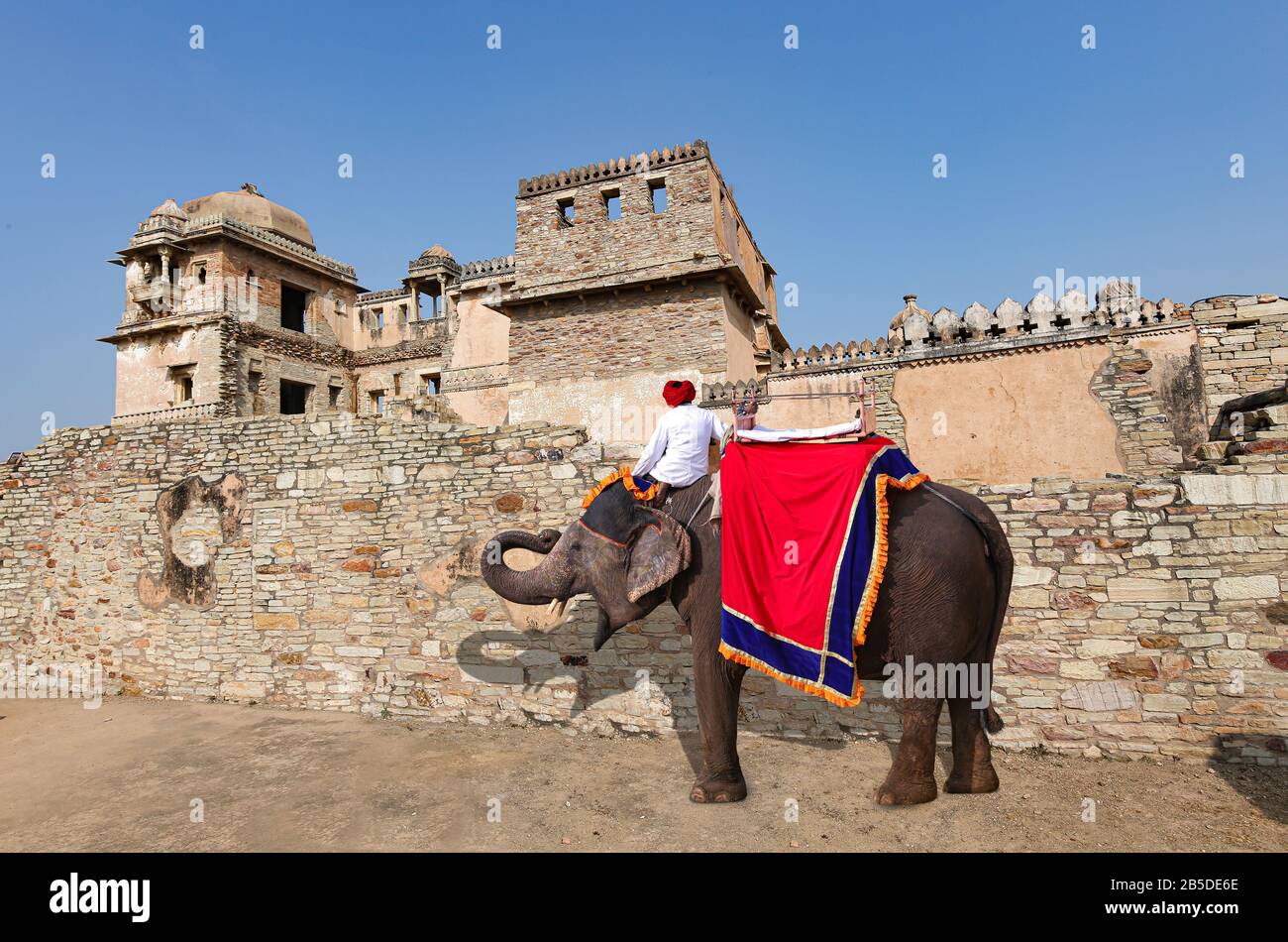 Rana Kumbha Palace at the historic Chittorgarh Fort Rajasthan with view of decorated Indian elephant used for tourist ride Stock Photo
