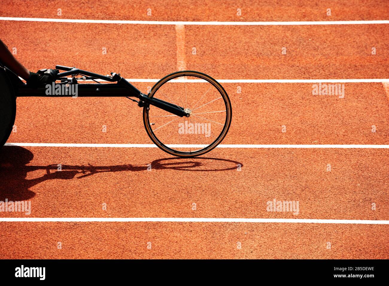 Front wheel of the sport bike for disabled person competition on the stadium track Stock Photo
