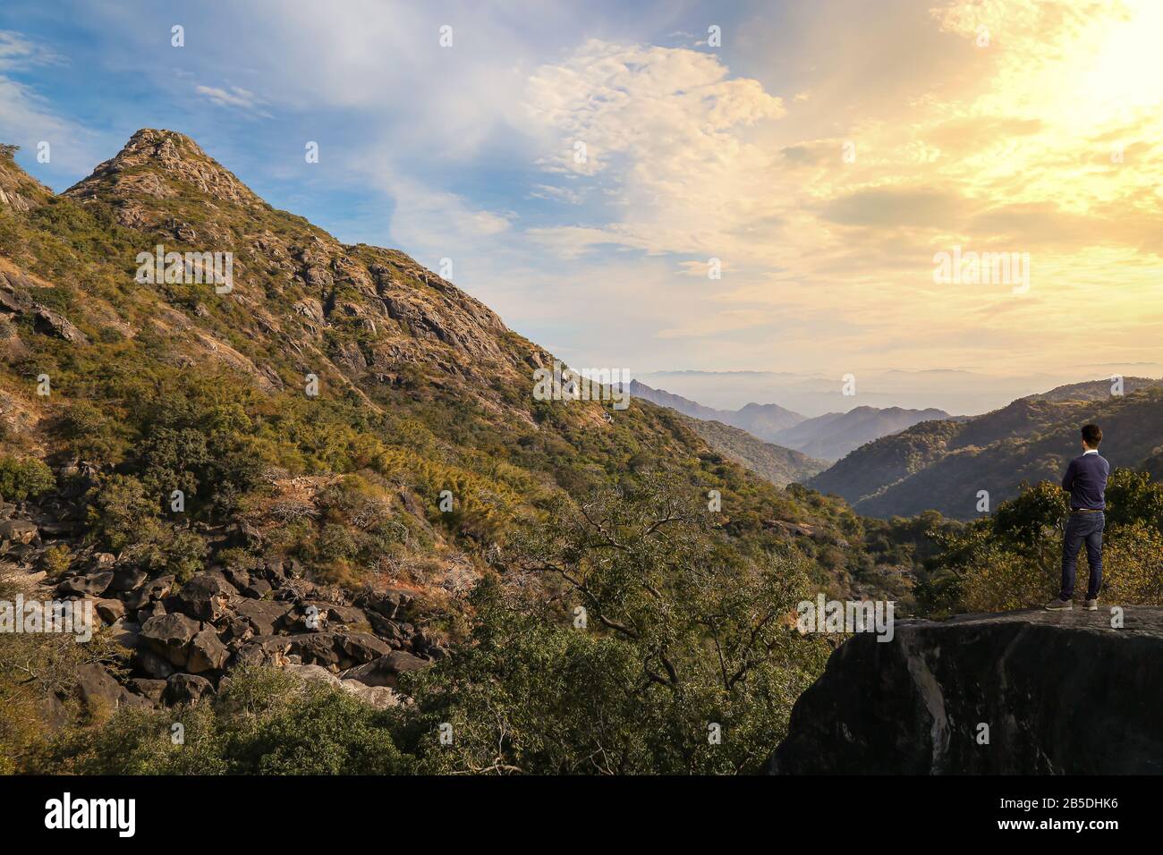 Male tourist enjoy sunrise view at Mount Abu Rajasthan India with scenic mountain landscape Stock Photo