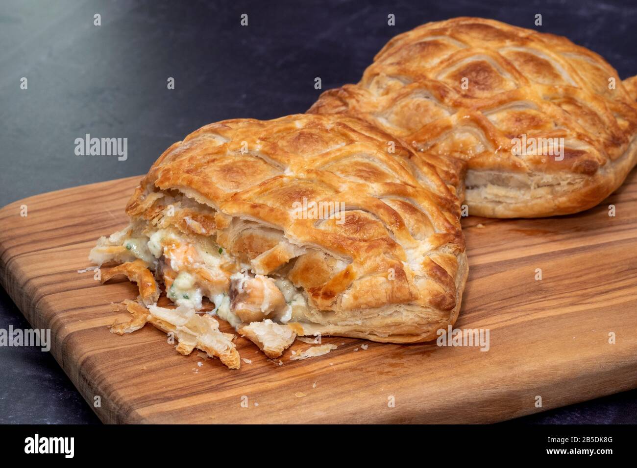 Two pastry parcels of salmon encroute Stock Photo Alamy