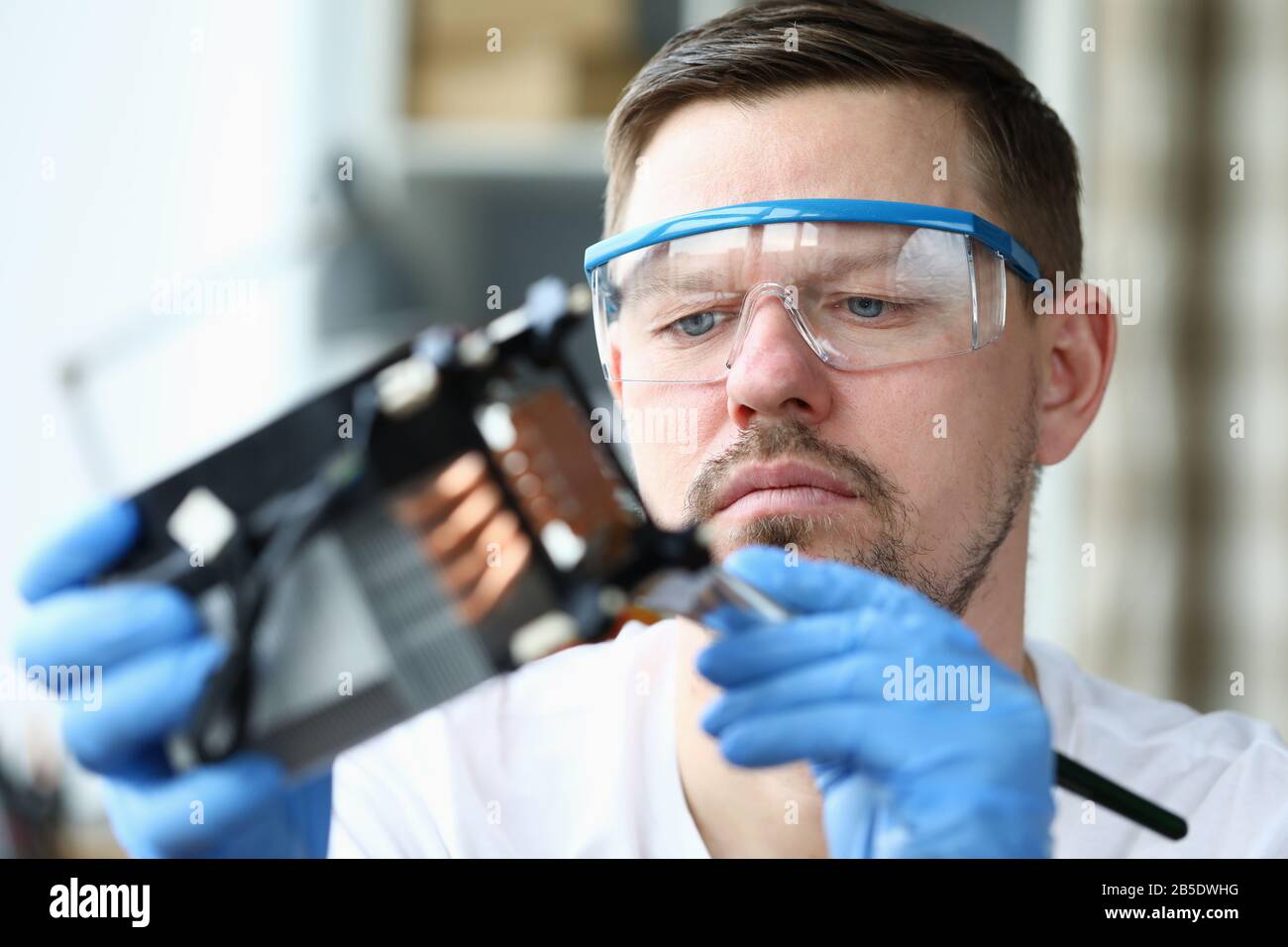 Serious mechanic repair mechanism Stock Photo