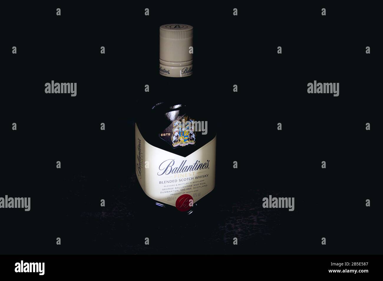 Izhevsk, Russia-March 01.2020: A bottle of Ballantine's whiskey on a black background. World famous whiskey brand. Scotch whiskey Stock Photo