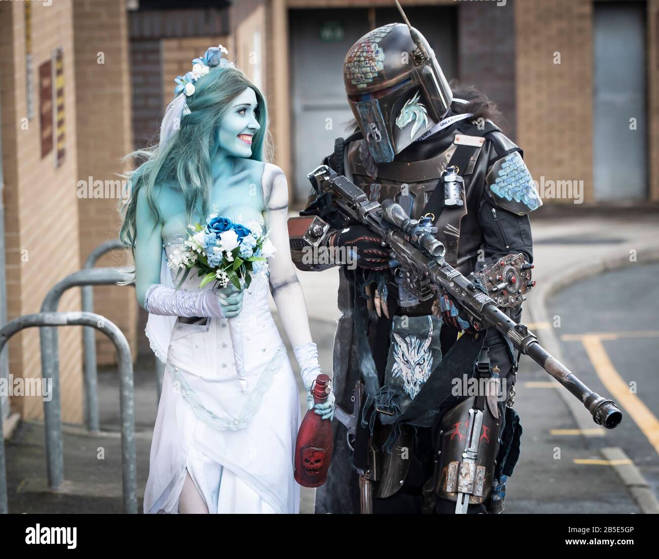 Natalia Williams dressed as Corpse Bride Emily and Tony Knight as a Mandalorian, arrive at the Bradford Unleashed Comic-Con at Bradford City AFC. Stock Photo