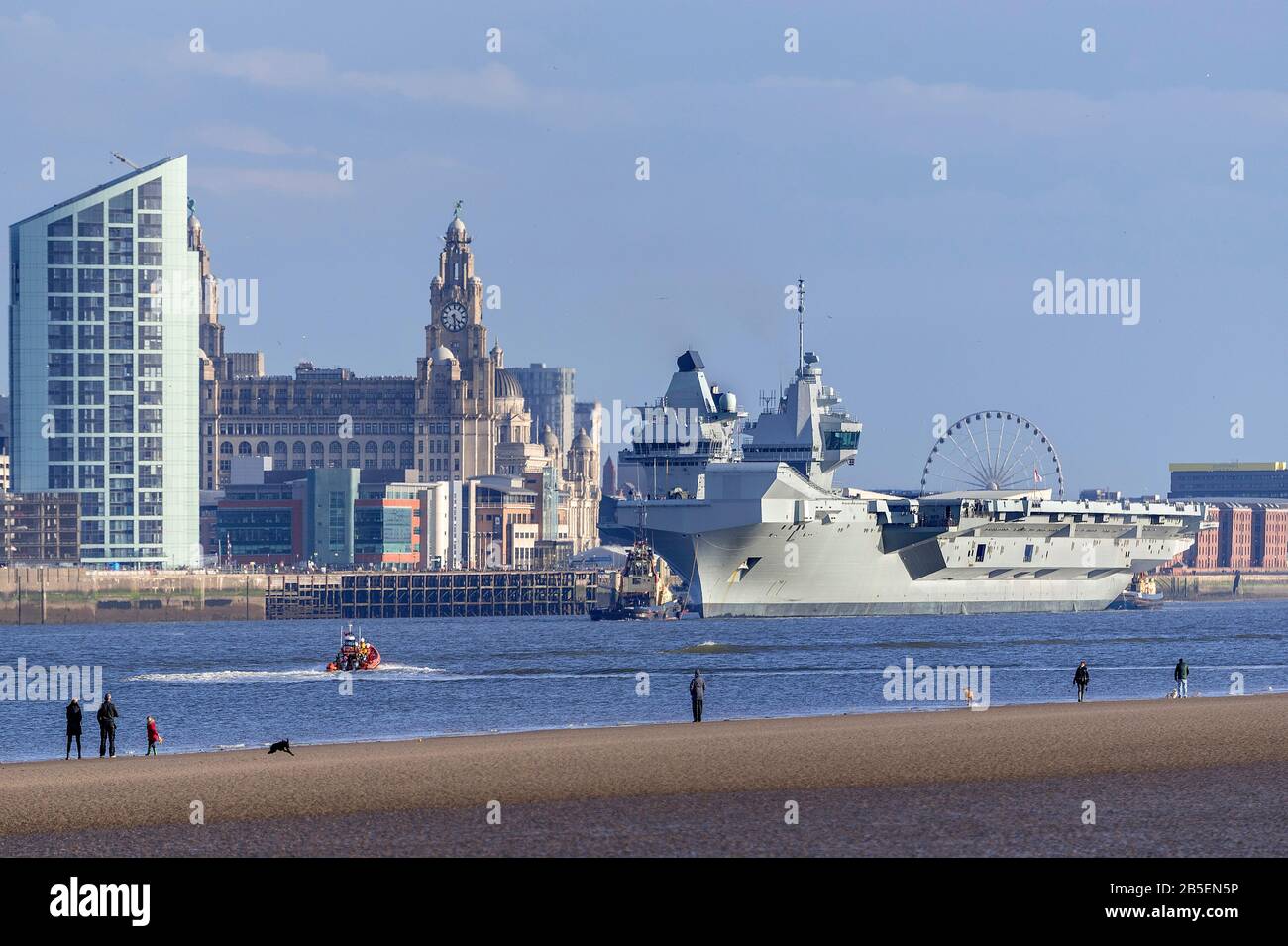 The Royal Navy's latest aircraft carrier HMS Prince of Wales leaves Liverpool pierhead after a week long courtesy visit. Stock Photo