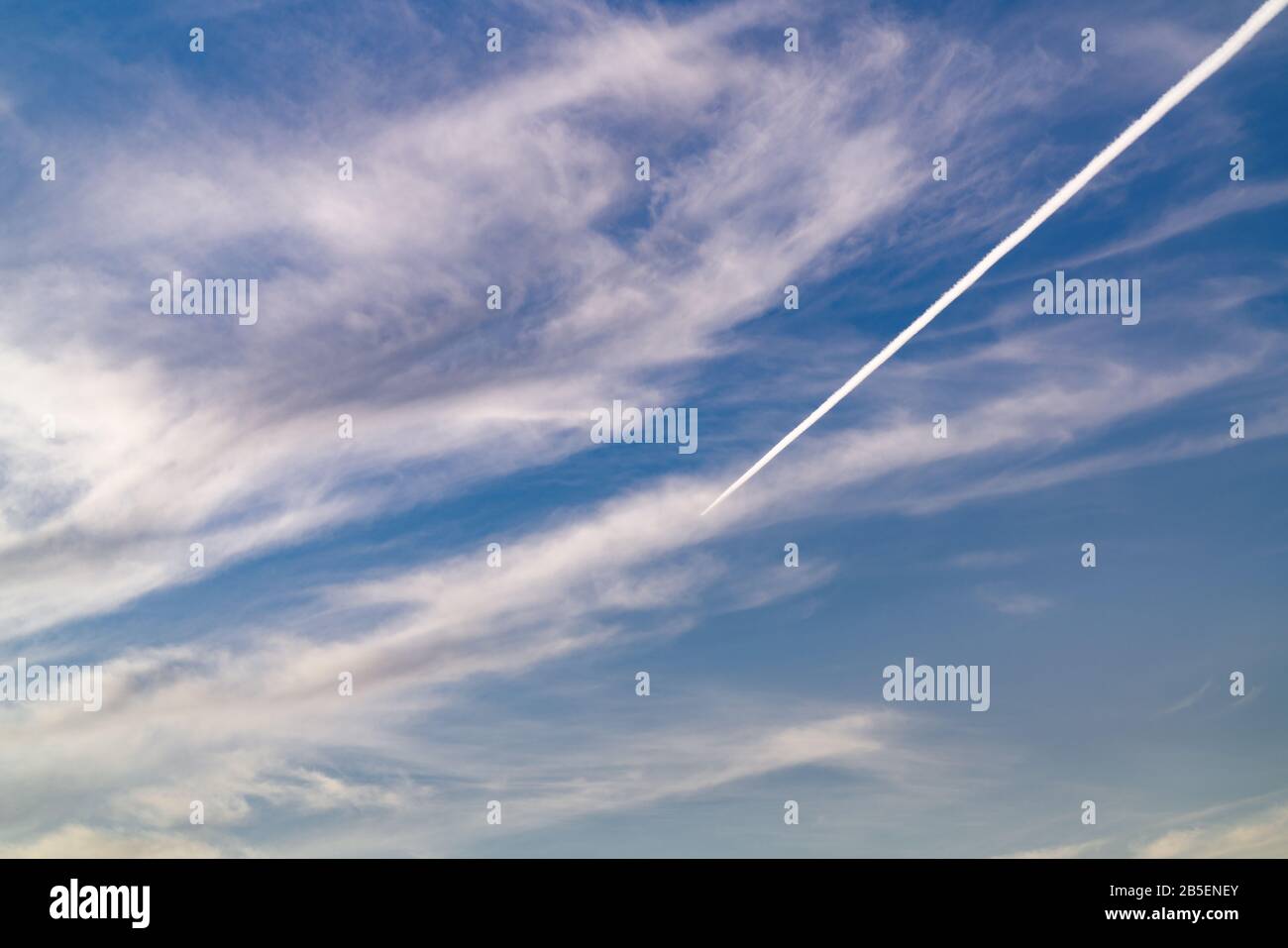 Airplane trace on the sky Stock Photo