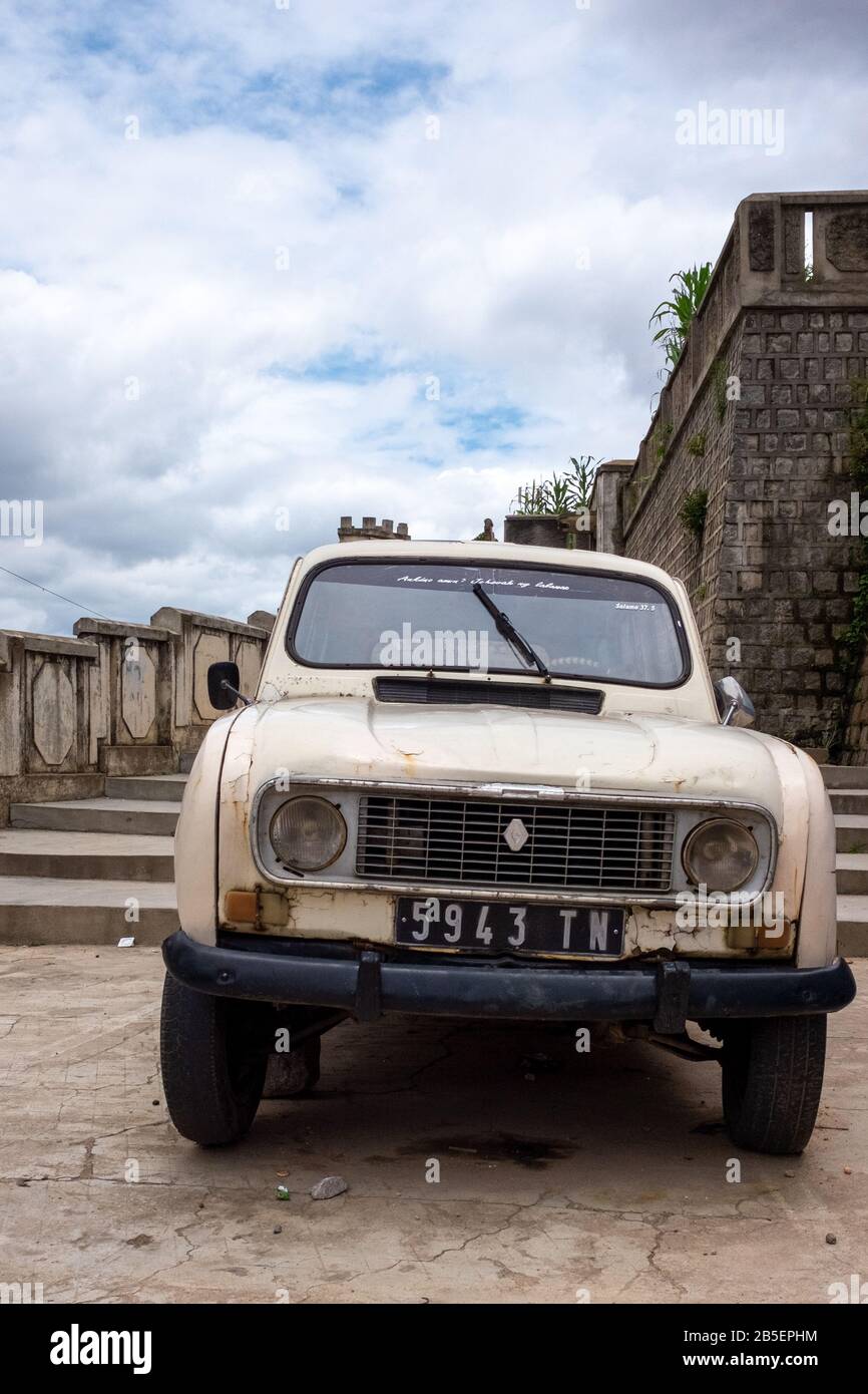 An old car parked in Antananarivo, the capital of Madagascar Stock Photo