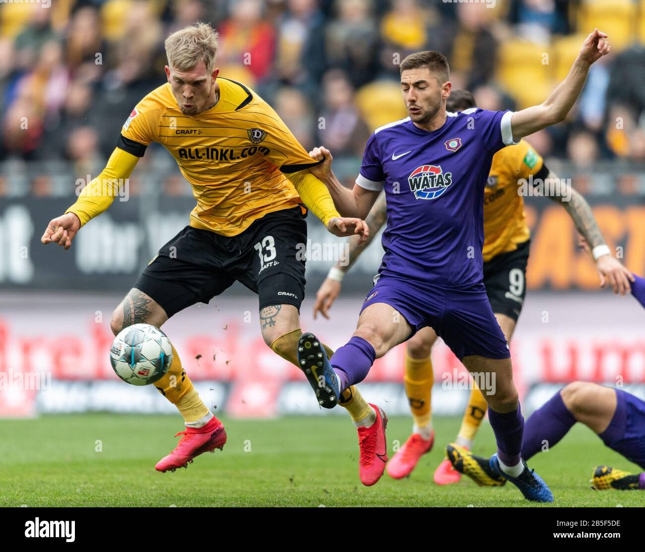 Dresden, Germany. 08th Mar, 2020. Football: 2nd Bundesliga, SG Dynamo Dresden - FC Erzgebirge Aue, 25th matchday, at the Rudolf Harbig Stadium. Dynamos Simon Makienok (l) against Aues Marko Mihojevic. Credit: Robert Michael/dpa-Zentralbild/dpa - IMPORTANT NOTE: In accordance with the regulations of the DFL Deutsche Fußball Liga and the DFB Deutscher Fußball-Bund, it is prohibited to exploit or have exploited in the stadium and/or from the game taken photographs in the form of sequence images and/or video-like photo series./dpa/Alamy Live News Stock Photo