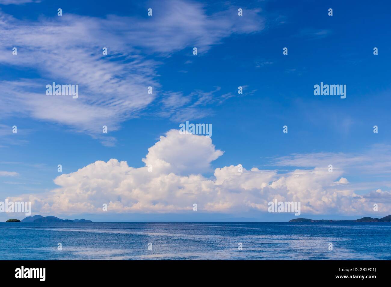Blue sky with white cloud and deep blue sea Stock Photo - Alamy