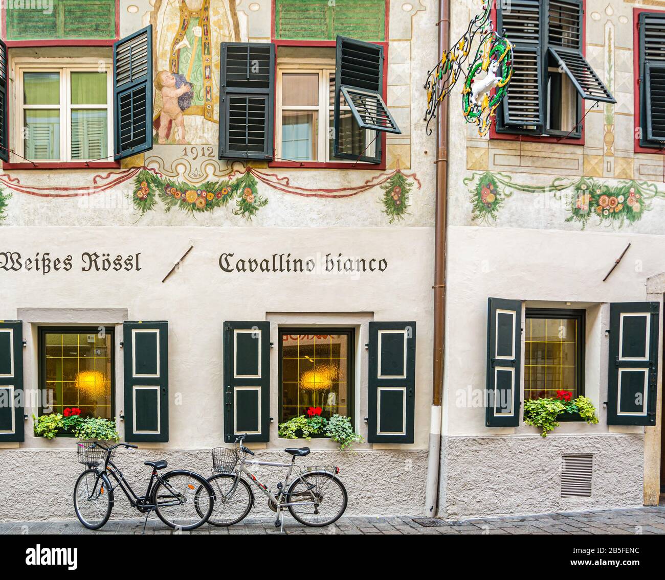 Facade of the building of the famous restaurant 'Cavallino Bianco' in the historic center of Bolzano in South Tyrol, Trentino Alto Adige, Italy Stock Photo
