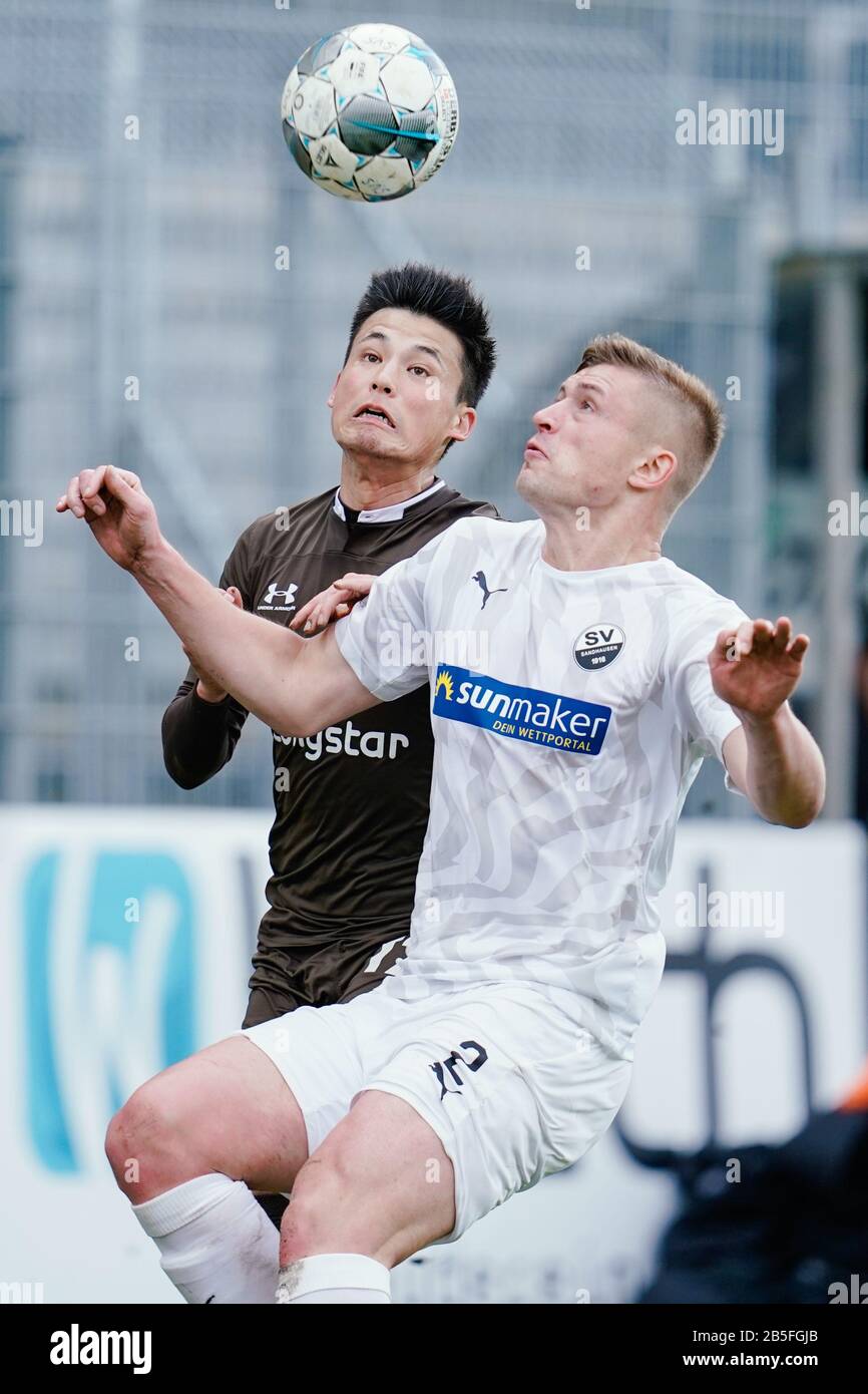 Sandhausen, Germany. 08th Mar, 2020. Football: 2nd Bundesliga, 25th matchday, SV Sandhausen - FC St. Pauli, Hardtwaldstadion. St. Paulis Ryo Miyaichi (l) and Sandhausen's Aleksandr Zhirov fight for the ball. Credit: Uwe Anspach/dpa - IMPORTANT NOTE: In accordance with the regulations of the DFL Deutsche Fußball Liga and the DFB Deutscher Fußball-Bund, it is prohibited to exploit or have exploited in the stadium and/or from the game taken photographs in the form of sequence images and/or video-like photo series./dpa/Alamy Live News Stock Photo