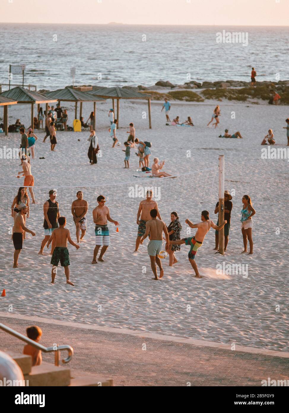A group of tourists playing beach volleyball in Australia Stock Photo