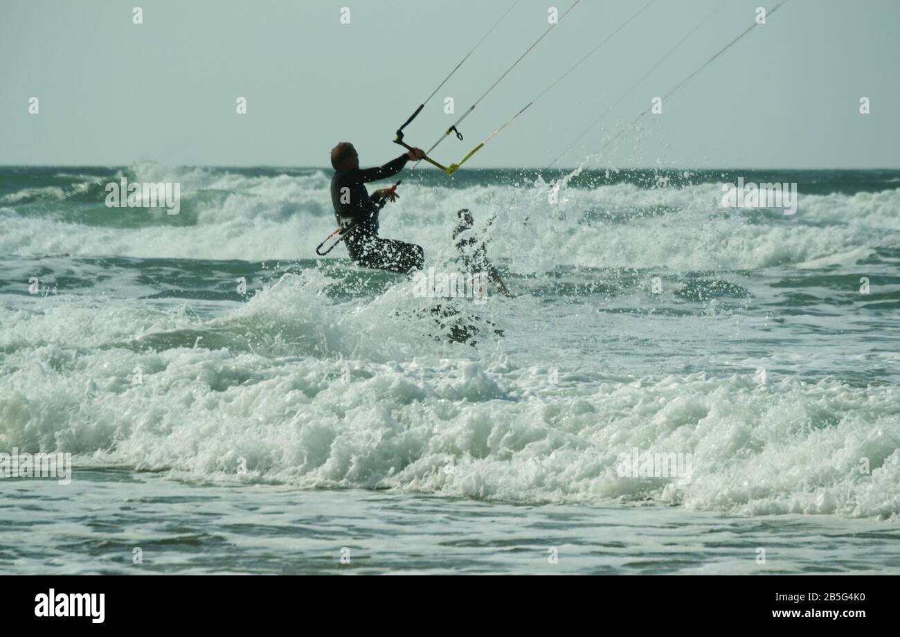 Kitesurfer is riding the waves hi-res stock photography and images - Alamy