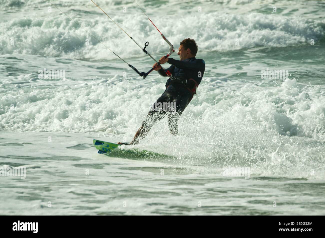 Kite surfer skimming through shallow water close to the beach at Lacanau-Océan, France Stock Photo