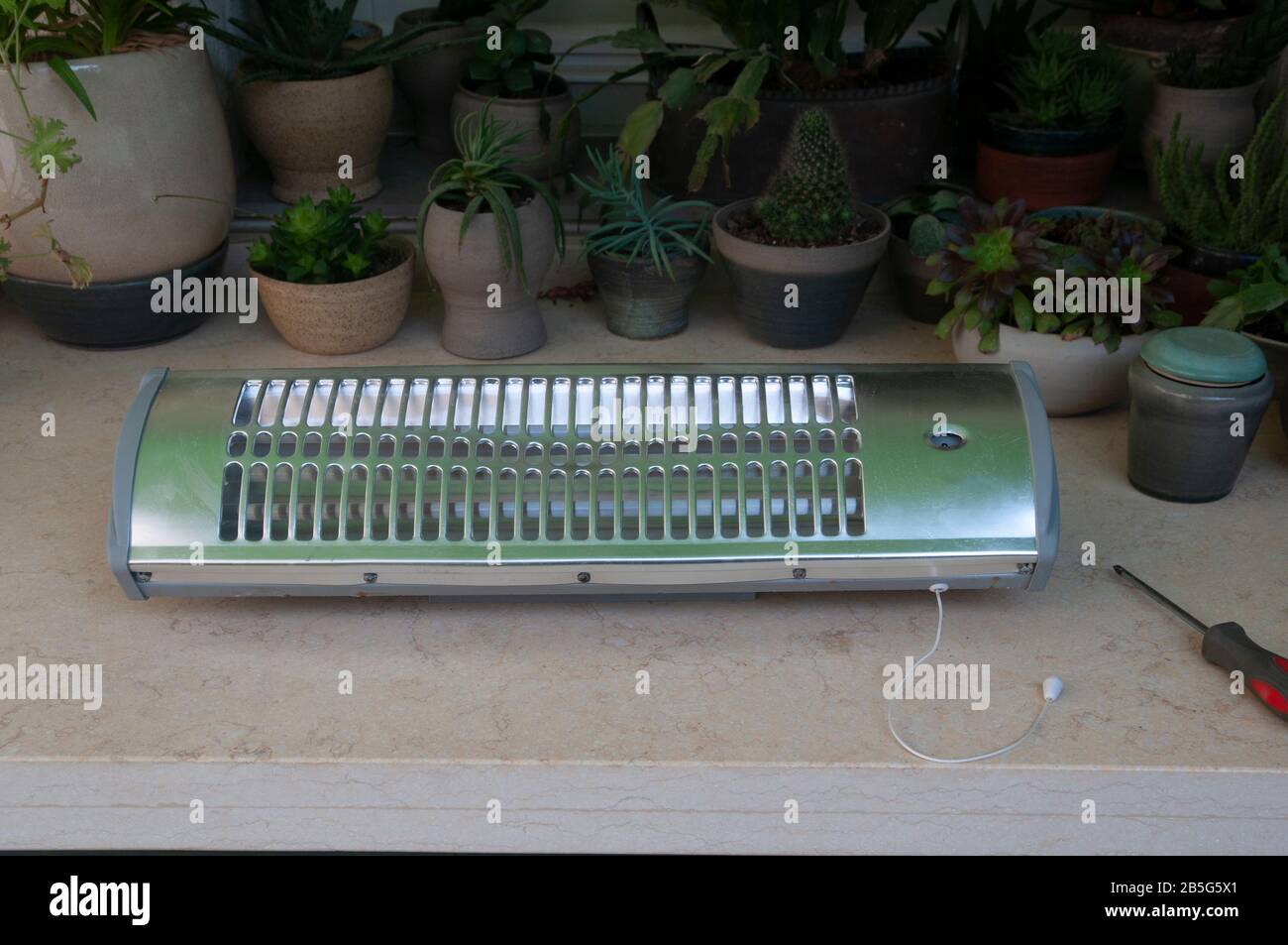 Dismantling (Actually, trying unsuccessfully to fix) an electric heater Stock Photo Alamy