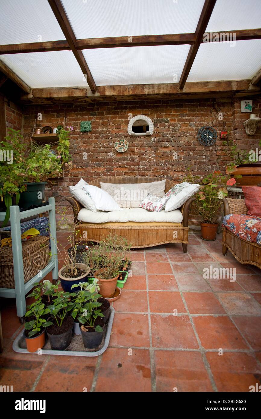 Summerhouse interior with potted plants. Oxfordshire, uk Stock Photo