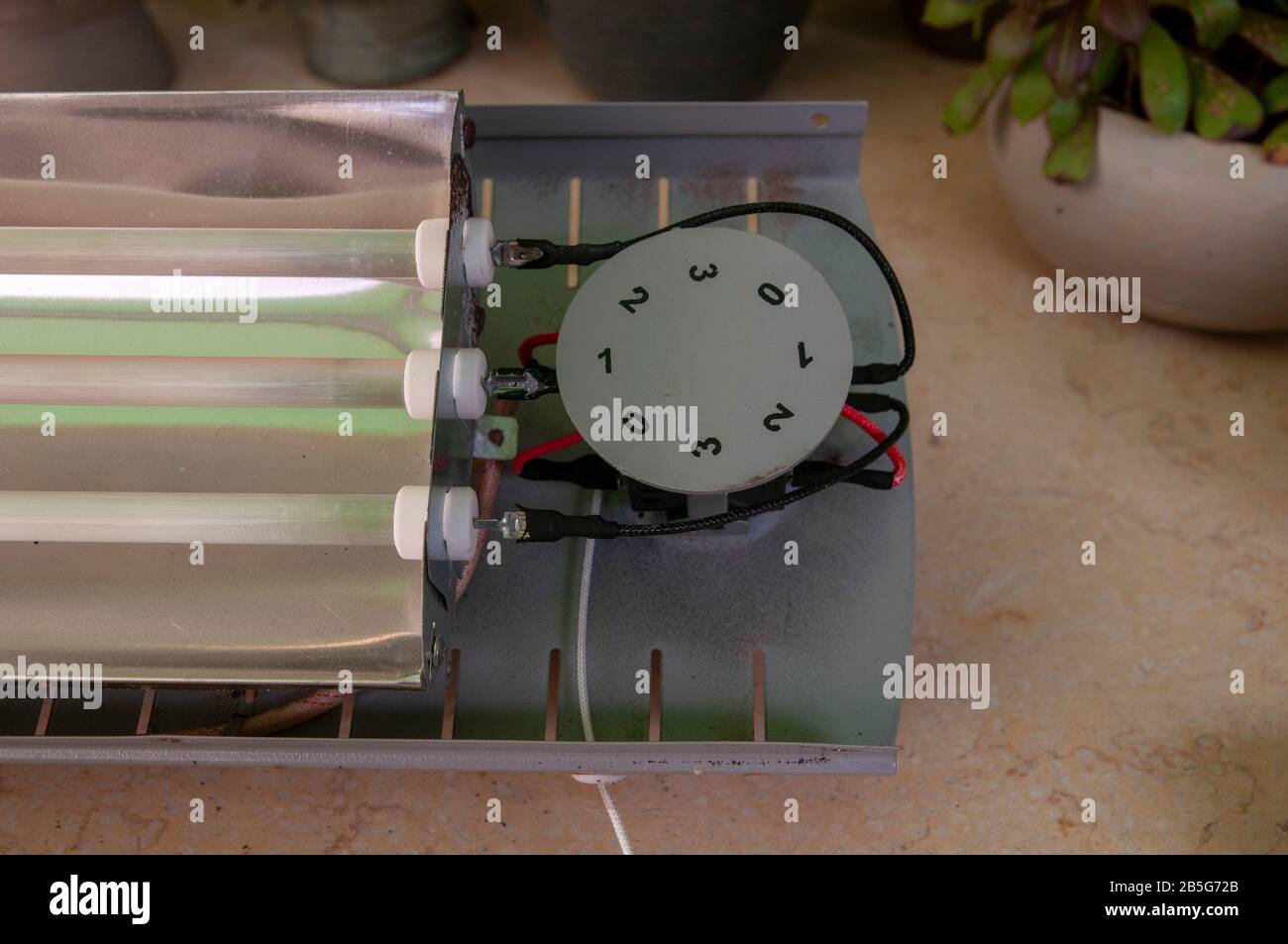 Dismantling (Actually, trying unsuccessfully to fix) an electric heater Stock Photo Alamy