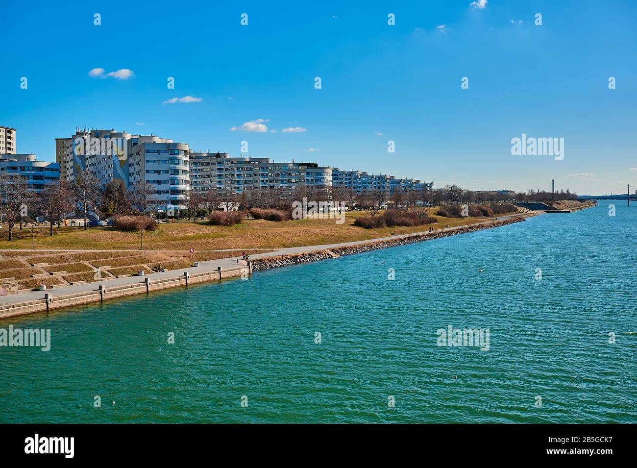 Vienna, Austria - Feb 20, 2020: Modern apartment houses on the Danube island in Vienna, Austria on a sunny day. Stock Photo