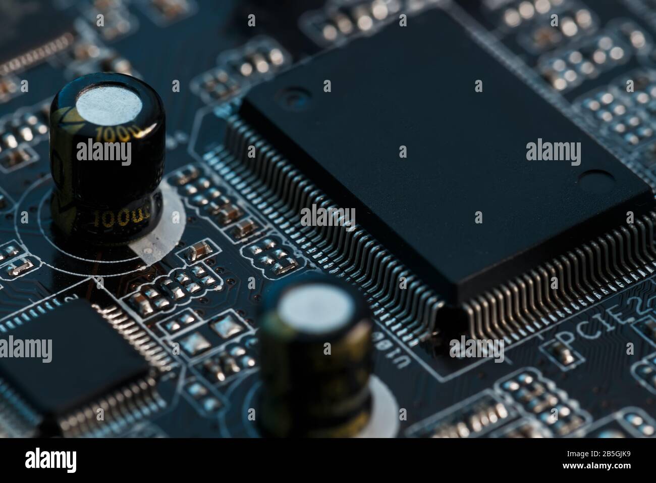 Electronic circuit board close up. Processor, chips and capacitors