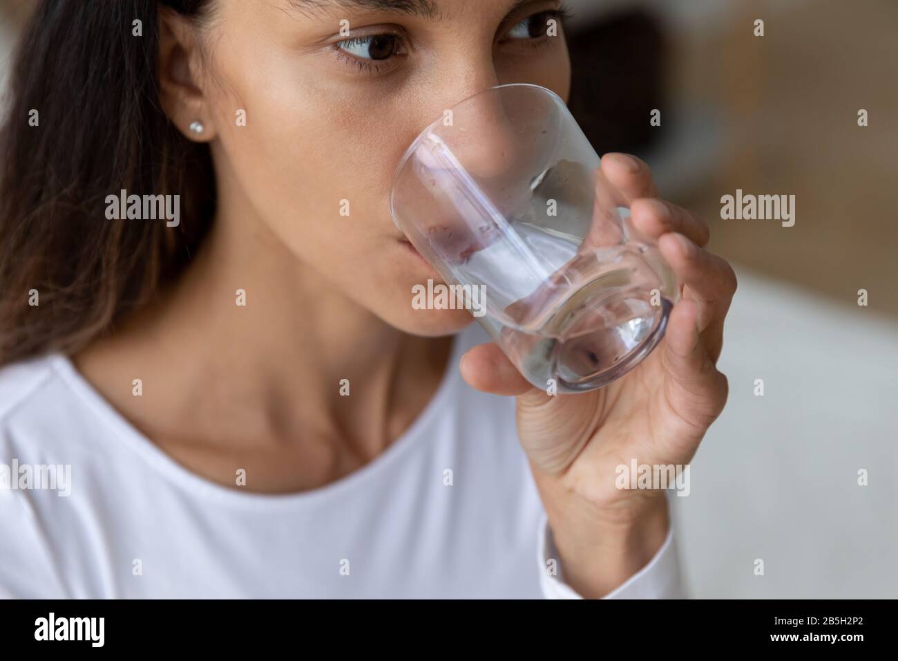 Thirsty girl enjoy drinking pure mineral water Stock Photo