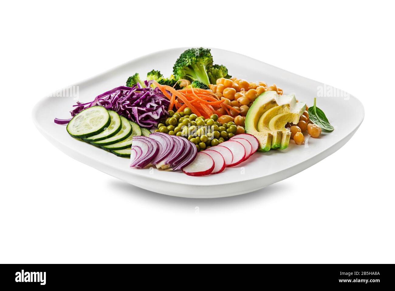 Healthy vegan lunch plate isolated on white. Avocado, chickpeas, broccoli, red cabbage, green peas, red onion and radish vegetables salad. Healthy bal Stock Photo