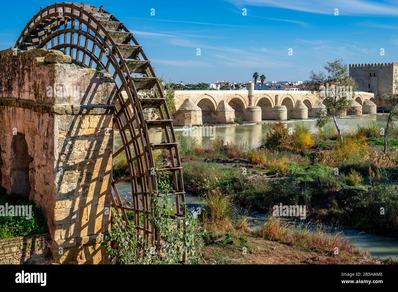 The Roman bridge and the remains of the medieval mill on the banks of the river Guadaquivir in Cordoba, Andalusia, Spain. Stock Photo