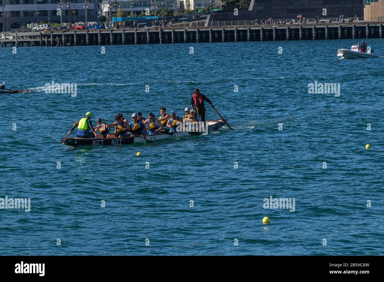 Dragon Boat Team rowing to start line for heat Stock Photo