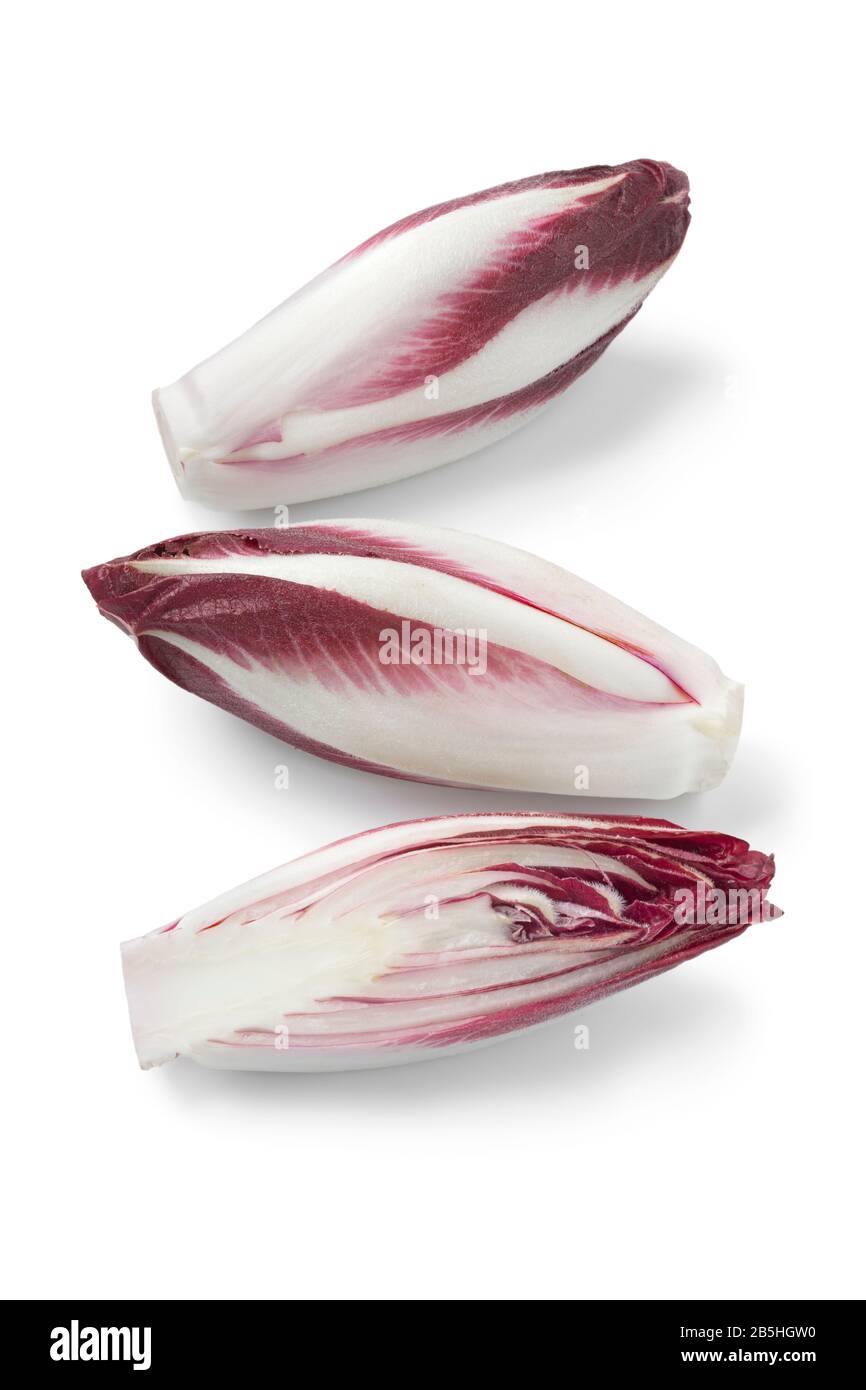 Whole and half raw Italian Radicchio rosso isolated on white background Stock Photo