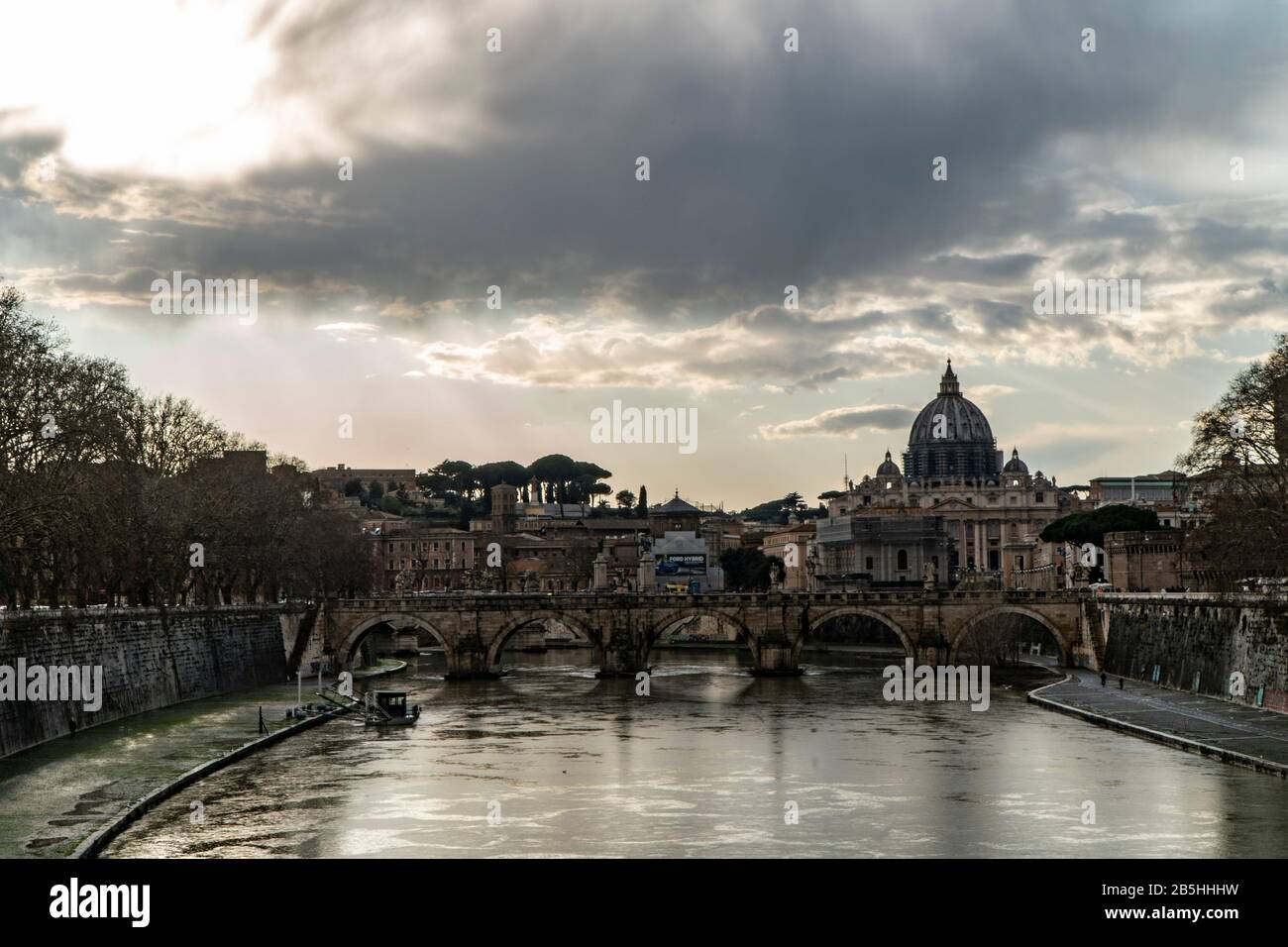The Papal Basilica of St. Peter, west of River Tiber in Rome, Italy cloud day Stock Photo