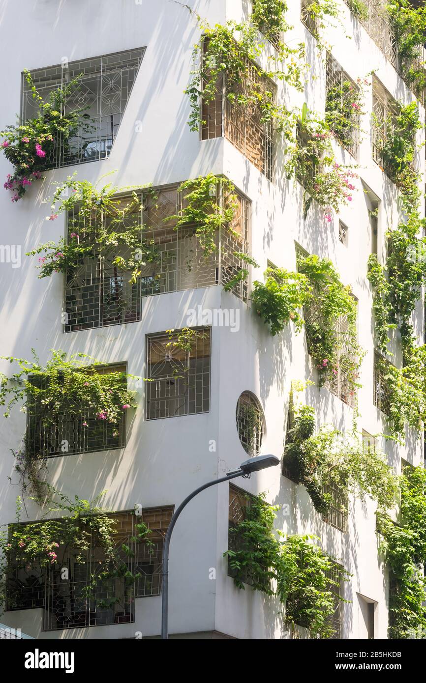 Ho Chi Minh City Vietnam - Building decorated with greenery. Stock Photo