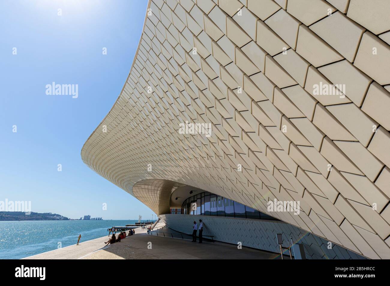 Tagus river and people in front of the Museum of Art, Architecture and Technology (MAAT) in Belem district in Lisbon, Portugal. Stock Photo