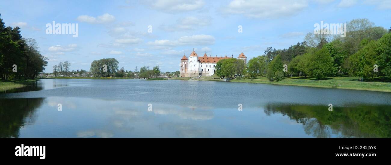 Beautiful panoramic view of an old medieval castle on the lake with ...