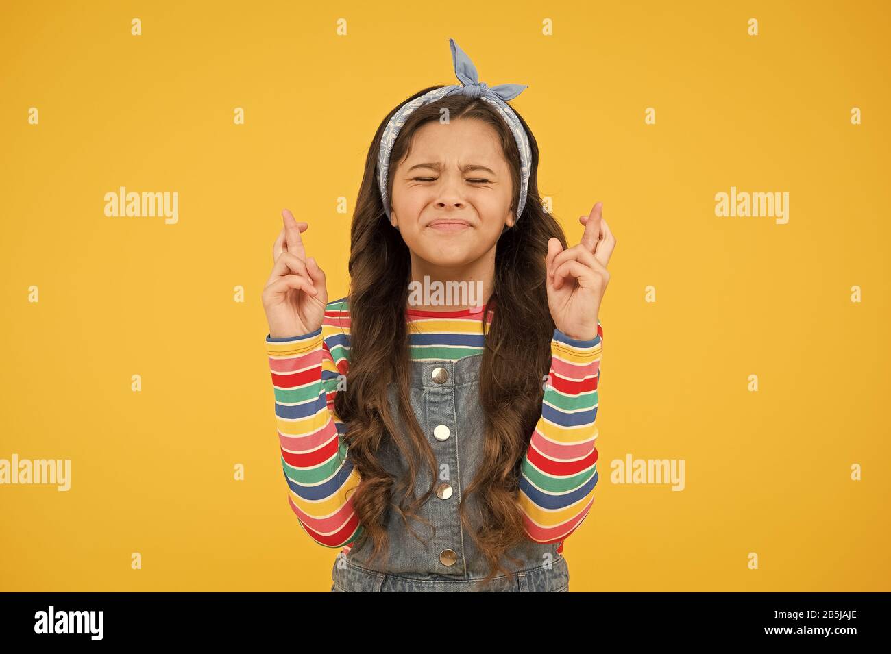 Believe In Herself Cute Child Make Wish Yellow Background Little Child Keep Fingers Crossed For Luck Small Child With Long Hair In Casual Fashion Child Dream Hopeful Concept Hope For Best Stock