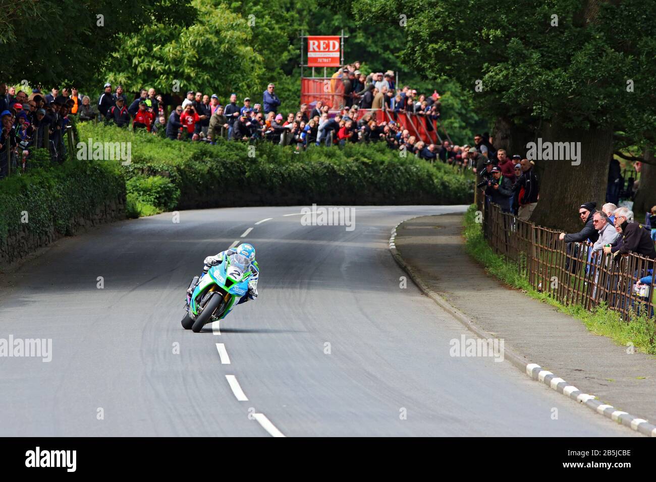 Dean Harrison power sliding away from the K Tree during the 2019 Senior TT motorcycle race on the Isle of Man on his Silicone Racing Kawasaki Stock Photo
