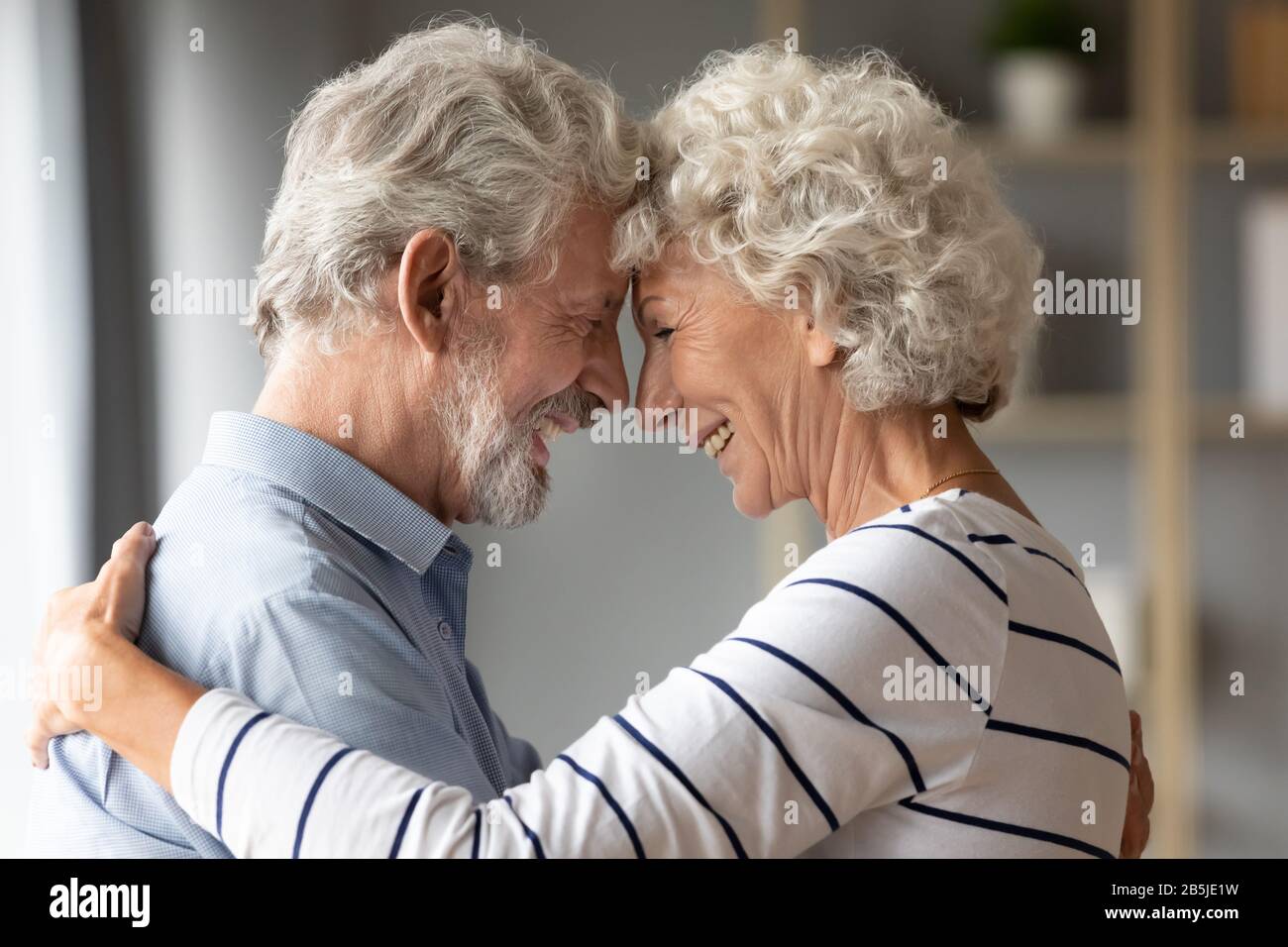 Smiling mature husband and wife share romantic moment together Stock Photo  - Alamy