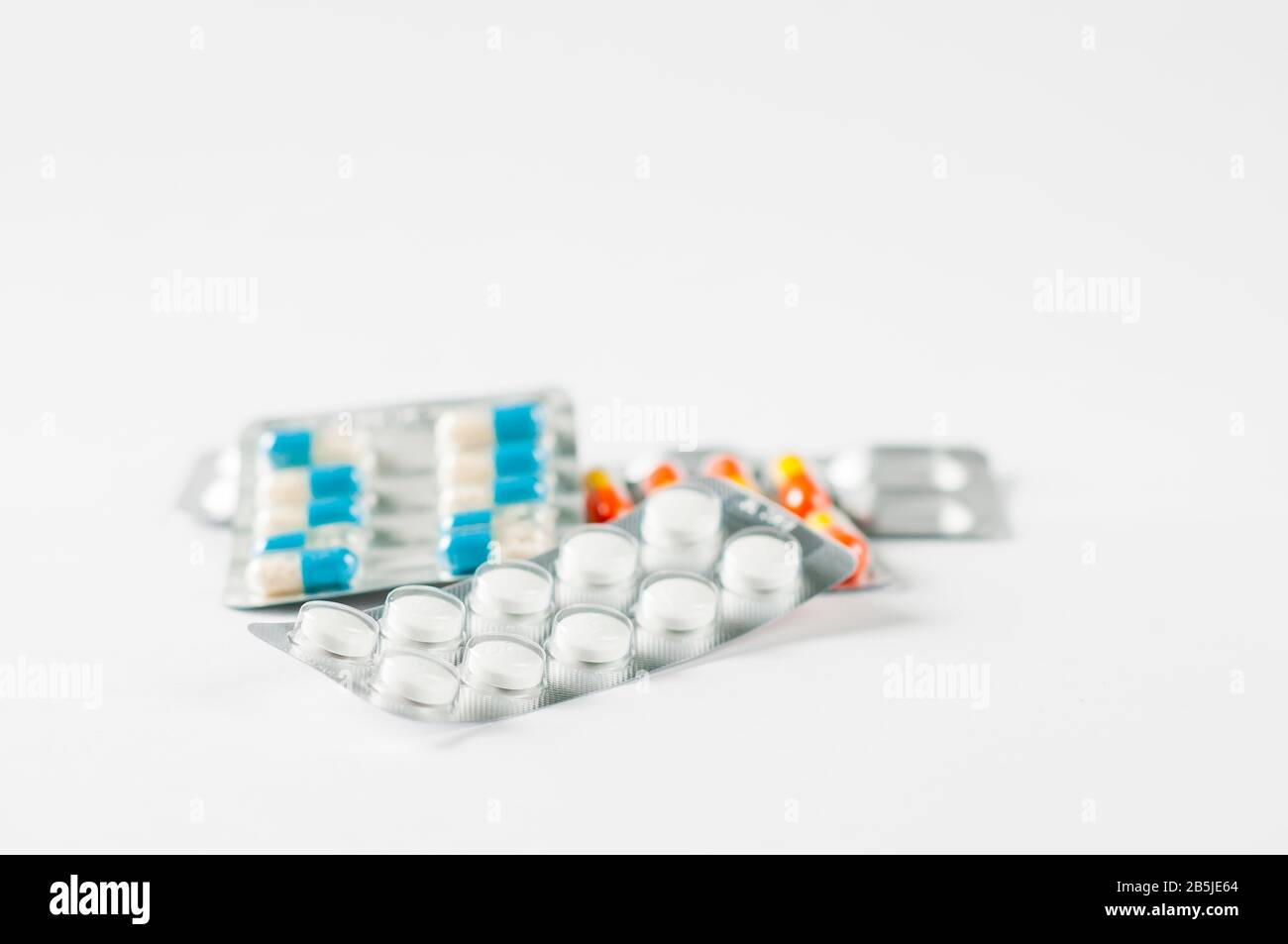 antibiotics capsule pills in blister pack Pharmacy background. Antimicrobial drug resistance. Pharmaceutical industry. Global healthc Stock Photo