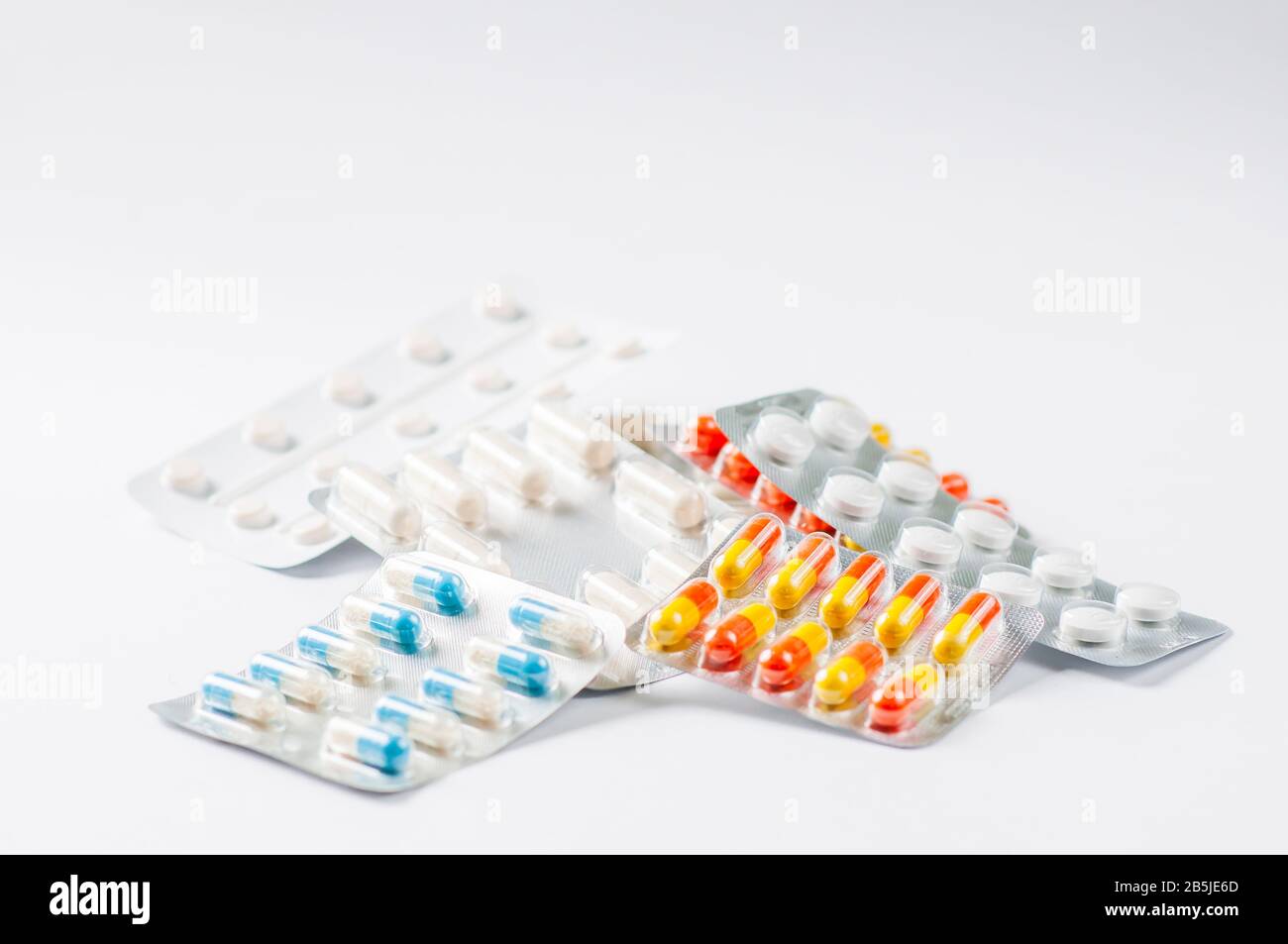 Closeup colorful antibiotics capsule pills in blister pack Pharmacy background. Antimicrobial drug resistance. Pharmaceutical industry. Global healthc Stock Photo