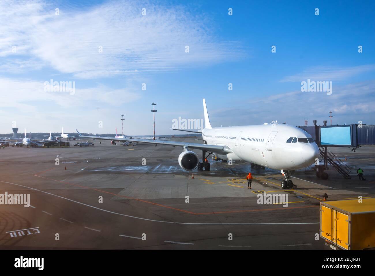 Passenger aircraft is ready for departure terminal by day flight, gangway waiting for to disconnect Stock Photo
