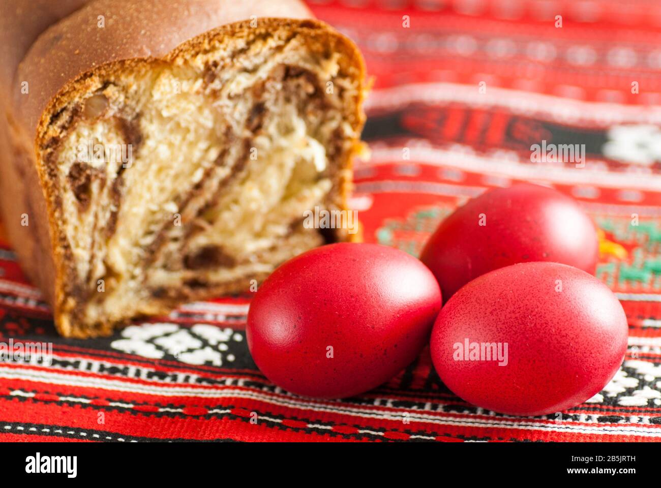 traditional orthodox sponge cake and colored easter eggs Stock Photo