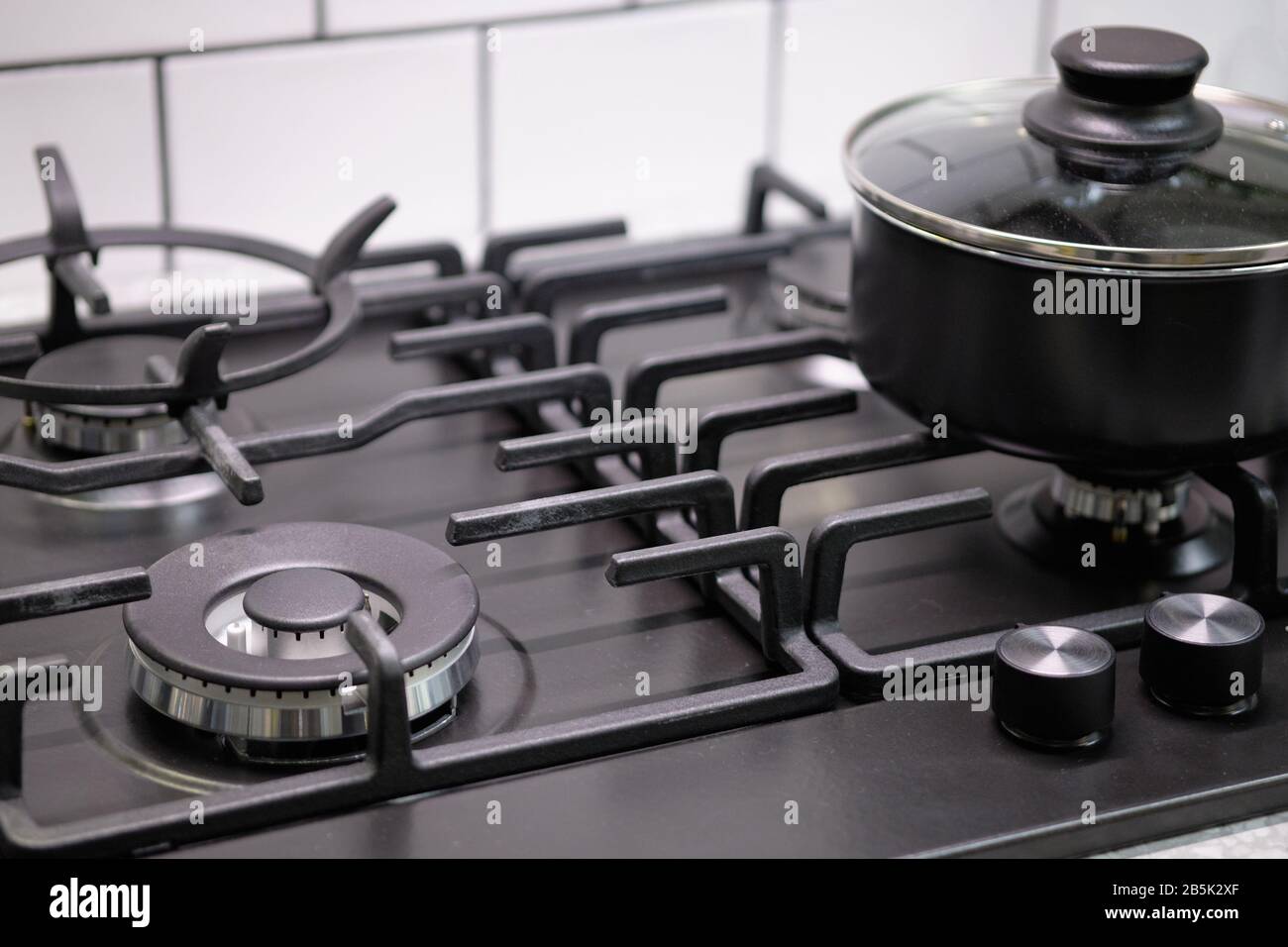 Kitchen modern gas black stove. Close up Stock Photo - Alamy