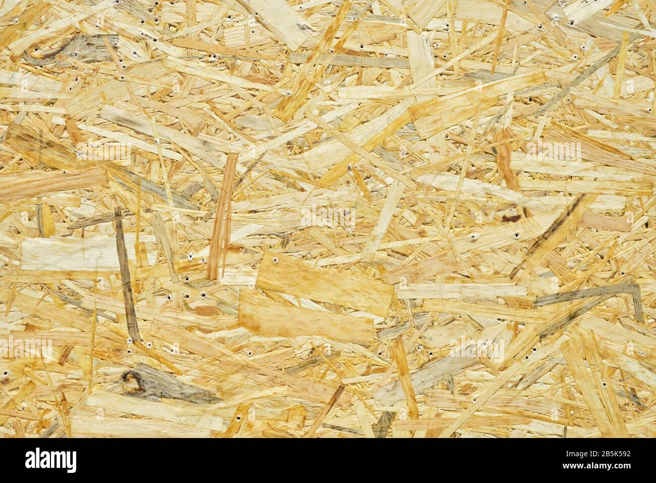 Pressed sawdust as background and texture. Close up. Stock Photo