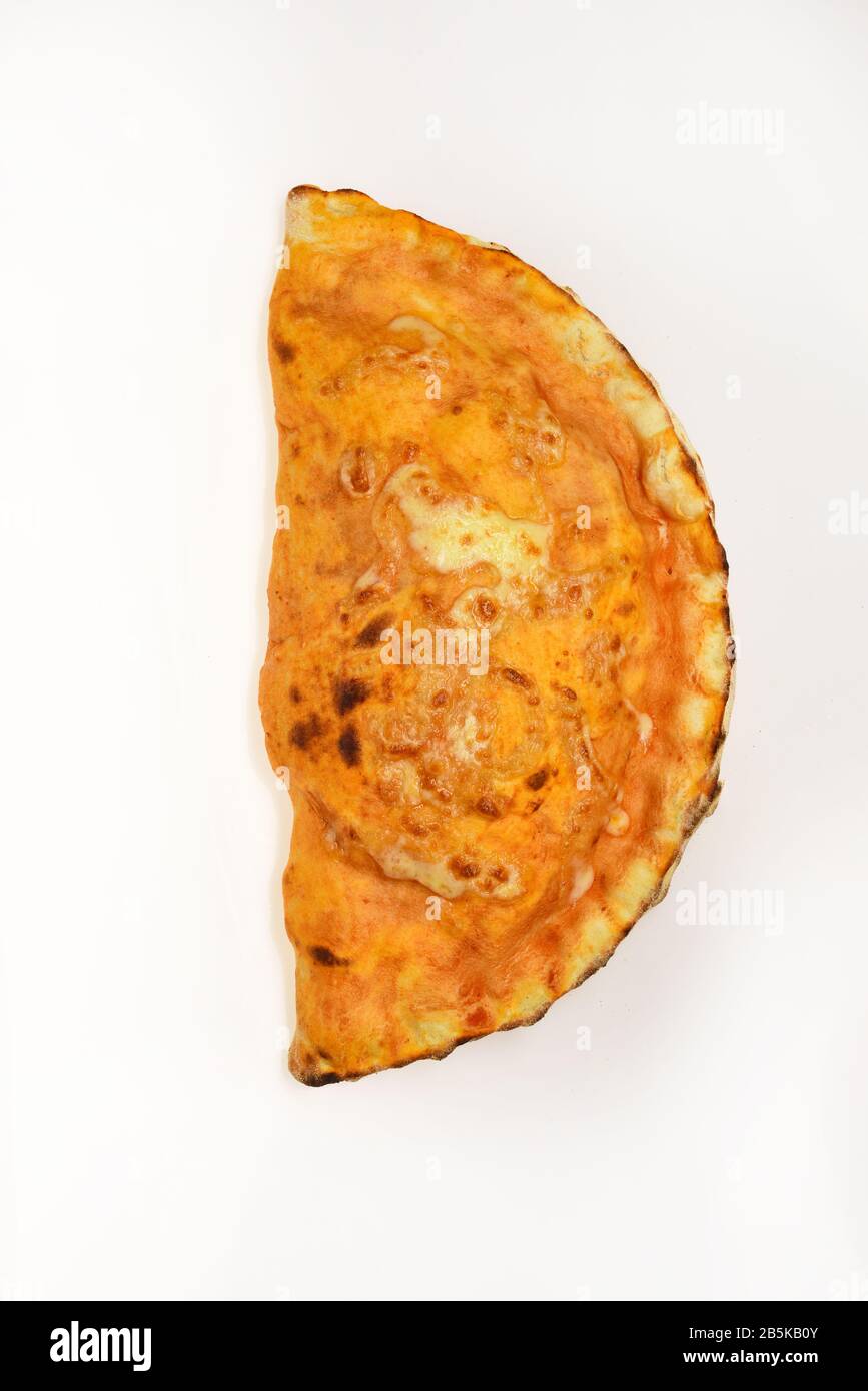 Pizza calzone with olive oil on top. Take away food of special shape