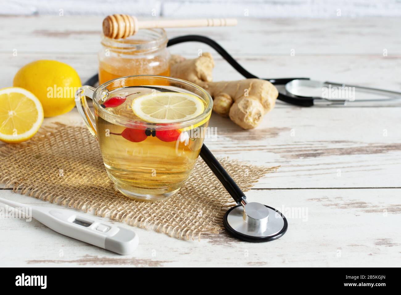 Cup of tea with chamomile, lemon, ginger and honey. Alternanive