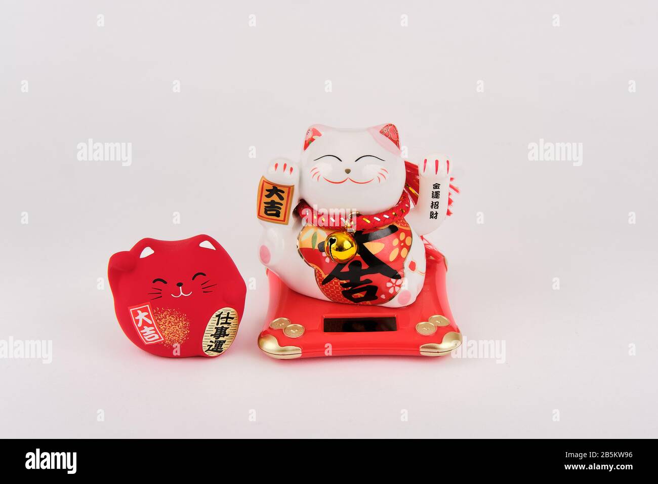 Two white and red chinese good fortune luck cats Stock Photo Alamy